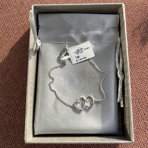 0.04 CT. T.W. Diamond Interlocking Hearts Bracelet in Sterling Silver - 6.75" - Picture 8 of 10